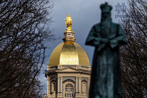 MLC 2.4.25 Dome 02.jpg by Michael Caterina/University of Notre Dame February 4, 2025; The Dome lit by the sun and Edward Sorin Statue in silhouette. (Photo by Michael Caterina/University of Notre Dame)