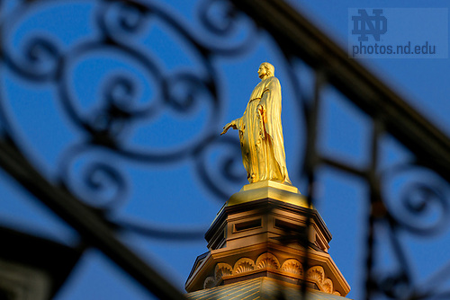 MC 8.1.25 Mary Statue Scenic.JPG by Matt Cashore/University of Notre Dame August 1, 2025; Dome framed by wrought iron stair railing (Photo by Matt Cashore/University of Notre Dame)